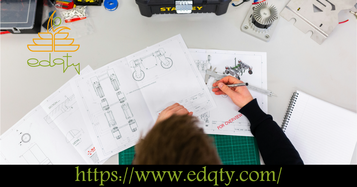 Engineer working on technical drawings at a desk representing the popularity and practical focus of engineering programs