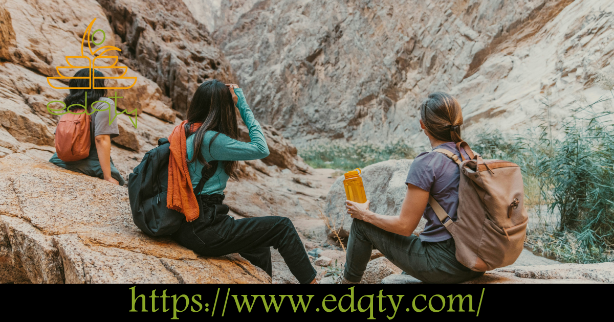 A group of students hiking and exploring a rocky canyon symbolizing a lifelong passion for exploration and learning