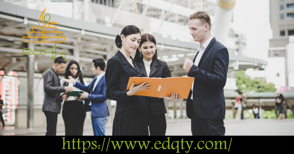 Young professionals in formal attire reviewing documents representing career opportunities for engineering graduates in Canada